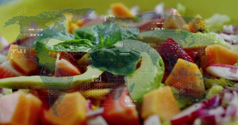 Futuristic healthy salad with avocado, mango, strawberry and world map hud overlay