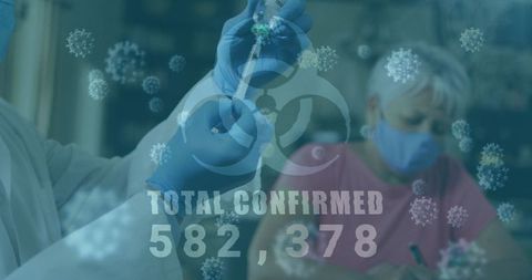 Medical Professional Preparing COVID-19 Vaccine Amid Pandemic Statistics