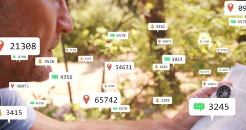 Mature man holding compass and map examining location pin overlays in forest