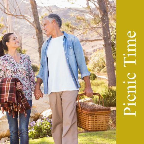Smiling Senior Couple Enjoys Relaxing Picnic in Park Setting