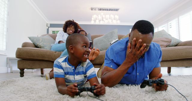 Father and Son Playing Video Games While Family Watches - Download Free Stock Images Pikwizard.com