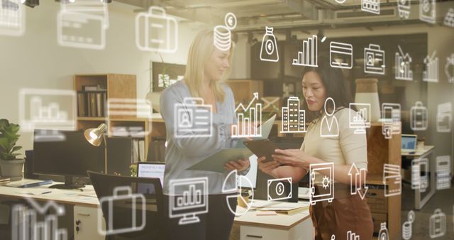 Two Businesswomen Analyzing Data with Augmented Reality in Modern Office - Download Free Stock Images Pikwizard.com