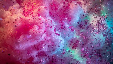 Iridescent cotton cloud macro with metallic confetti, colorful bokeh and dreamy nebula texture