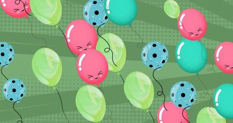Colorful Party Balloons Floating Over Vibrant Green Background