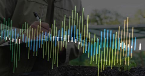 Botanist Analyzing Data in Greenhouse with Seedling and Charts