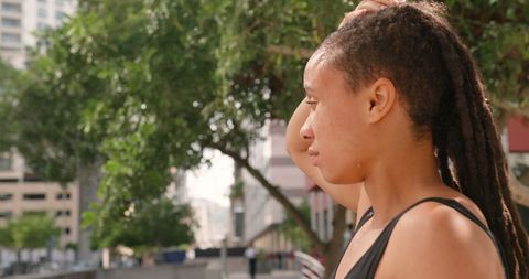 Thoughtful African American Woman on City Bridge