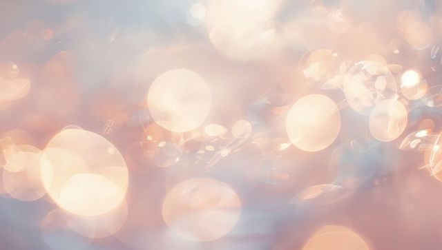 Soft peach bokeh with warm circular orbs, sparkling specular highlights, dreamy glow