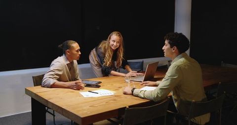 Diverse Team Discussing Strategyy at Office Table