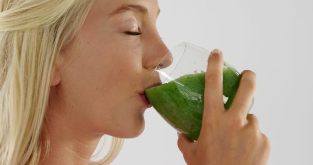 Young Woman Drinking Healthy Green Smoothie with Eyes Closed - Download Free Stock Images Pikwizard.com