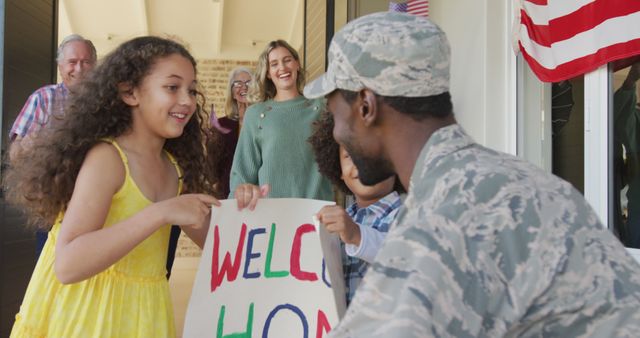 Image of happy diverse family welcoming soldier father. American patriotism, armed forces and family life.