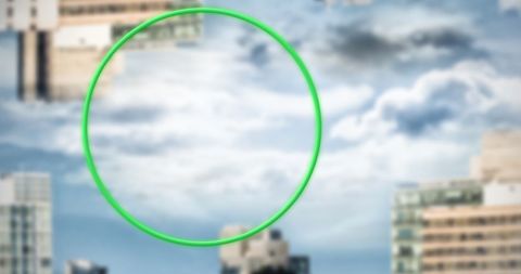 Green circular banner above inverted cityscape
