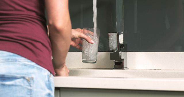 Person Filling Glass with Water from Modern Kitchen Faucet - Download Free Stock Images Pikwizard.com