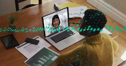 Young person engaged in a virtual business meeting at home