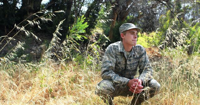 Young Soldier Resting in Tall Grass Outdoors - Download Free Stock Images Pikwizard.com