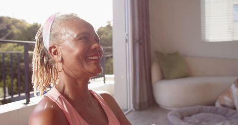 Smiling Senior Woman Enjoys Serene Indoor Space