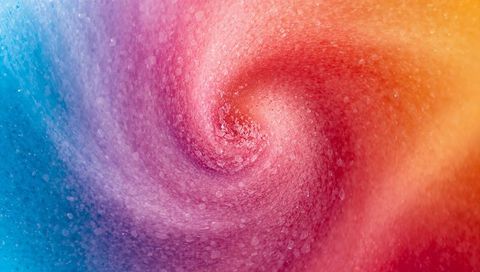 Swirling iridescent spiral vortex with granular bokeh and chromatic nebula gradient