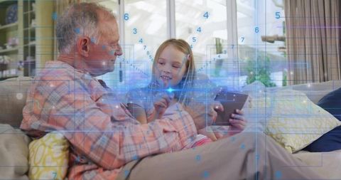 Grandfather and Granddaughter Sharing Tablet with Augmented Reality Holographic Interface