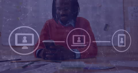 African Man Engaging with Technology in Office