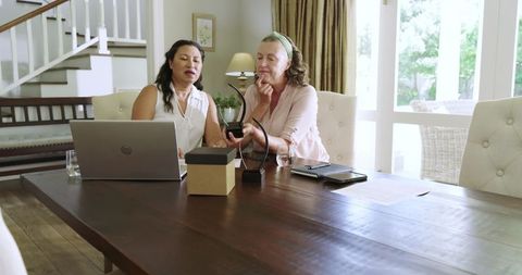Senior Women Enjoying Technology and Friendship at Home