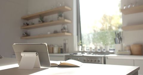 Modern Kitchen with Tablet on White Countertop in Sunlight - Download Free Stock Images Pikwizard.com