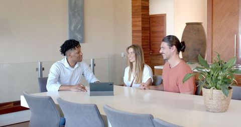 Diverse Team Discussing Project Ideas at Meeting Table