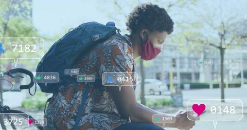 Young urban man engaging with smartphone and social media graphics