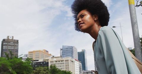 Businesswoman exploring urban cityscape with confidence