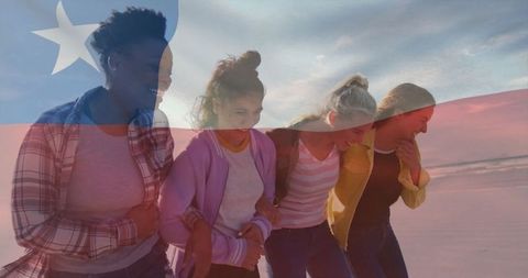 Group of Friends Enjoying Sunset on Beach with Liberian Flag Overlay