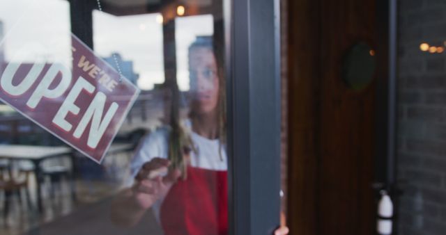 Cafe Employee Flipping Open Sign on Glass Door - Download Free Stock Images Pikwizard.com