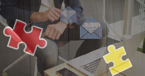 Businessman Working at Laptop with Autism Awareness Symbols