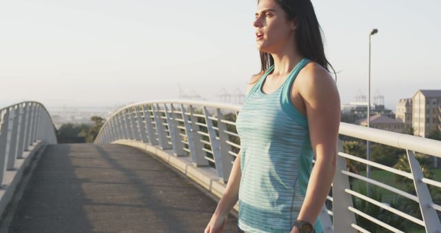 Young Woman Exercising Outdoors on Sunset Bridge - Download Free Stock Images Pikwizard.com