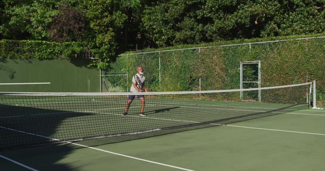 Senior Man Playing Tennis on Outdoor Court - Download Free Stock Images Pikwizard.com