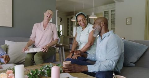 Joyful Seniors Sharing Coffee and Conversation in Cozy Home