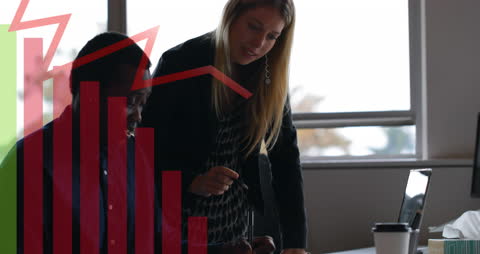 Business Professionals Analyzing Data with Red Graph Overlay