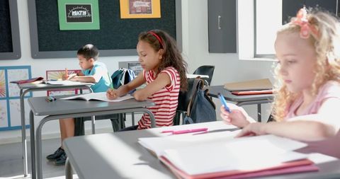 Children studying in a bright classroom setting