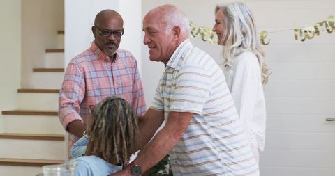 Joyful Senior Friends Enjoying Friendly Gathering at Home