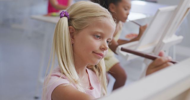 Young Girl Focused on Painting in School Art Class - Download Free Stock Images Pikwizard.com