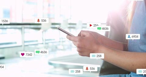 Female holding smartphone with floating social notifications showing digital engagement