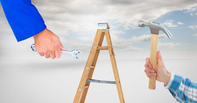 This scene shows hands holding a wrench and a hammer with a ladder in the background against a cloudy sky. This image is suitable for themes related to construction, home improvement, DIY projects, and tool use. It can be used in blog posts, advertisements, and promotional materials for hardware stores, construction companies, or DIY tutorials.