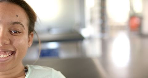 Smiling Woman in Rehabilitation Center Promoting Recovery and Wellness