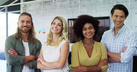 Diverse Young Professionals in Modern Office Smiling Confidently