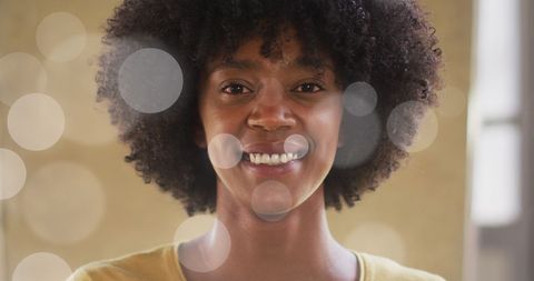smiling african american businesswoman amid light effects - Download Free Stock Images Pikwizard.com