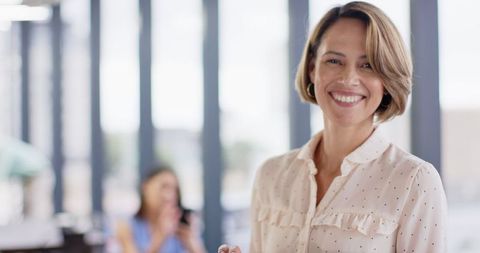 Confident Businesswoman Utilizing Tablet in Contemporary Office