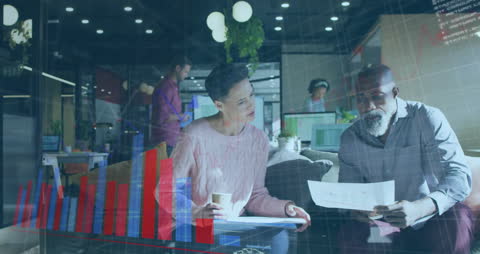 Diverse Team in Modern Office Analyzing Data and Technology