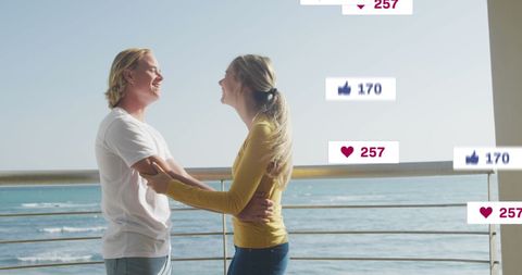 Romantic Couple by Ocean with Social Media Interaction