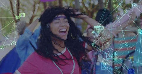Joyful Woman Dancing at Outdoor Festival with Futuristic Graphics
