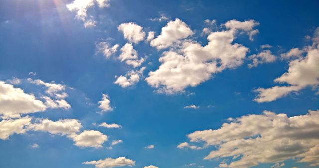 Bright Blue Sky with White Fluffy Clouds on a Sunny Day - Download Free Stock Photos Pikwizard.com