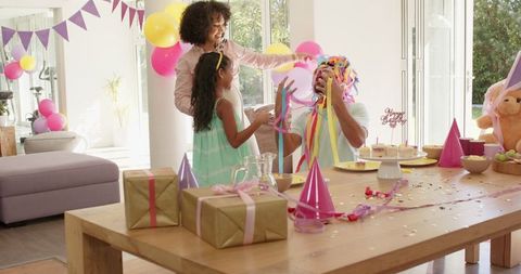 Joyful Family Celebrating Birthday at Home with Gifts and Decorations