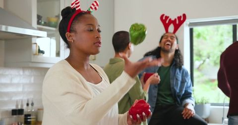 Friends celebrating with holiday cooking in cozy kitchen