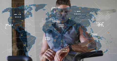 Checking Smartwatch While Cycling Home Trainer with Global Map Overlay Tracking Fitness